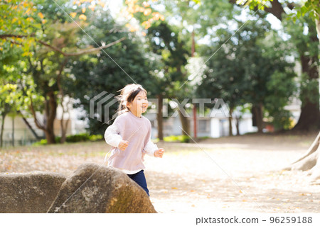 Girls playing in the park Girls playing in the park 96259188