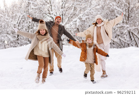 Happy kids have fun with parents outdoor in winter park, family rejoice snowy weather in forest Happy kids have fun with parents outdoor in winter park, family rejoice snowy weather in forest 96259211