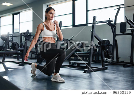 fitness woman doing exercises in the gym. 96260139