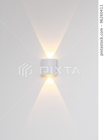 White wall light illuminating interior. modern trendy minimal ligthing. simple metallic decorative light 96260411