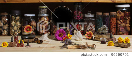 Meditation Altar With Rock Crystals and Flowers. Jars of Herbs in Background 96260791