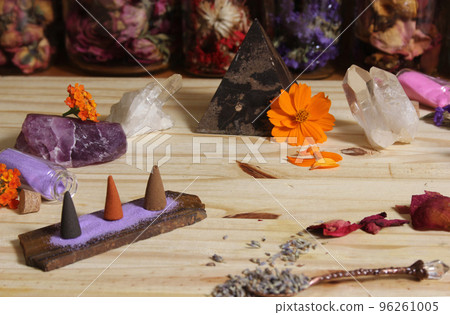 Dried Lavender and Rose Petals on Table With Incense Cones and Crystals 96261005