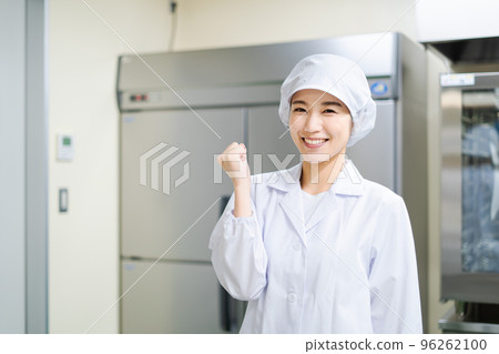 Young female cook (guts pose) 96262100