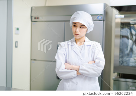 Young female cook (arms folded, worried, troubled) 96262224