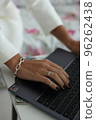 Cropped image of professional businesswoman working at her office via laptop, young female manager using portable computer devic 96262438