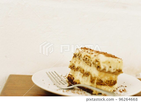 Tiramisu on a white plate Tiramisu on a white plate 96264668