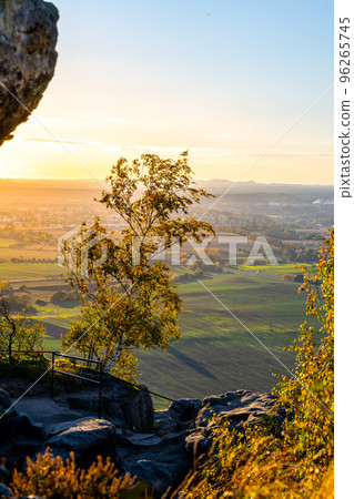 Sunset in Bohemian Paradise. Aerial view from Drabske svetnicky castle ruins. With Bezdez Mountain and Castle silhouette on background. Czech Republic 96265745