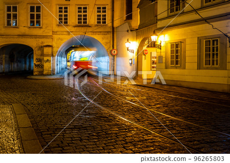 Night tram in Prague. Motion blurred tram going through tunnel in Letenska Street, Lesser Town of Prague, Czech Republic Night tram in Prague. Motion blurred tram going through tunnel in Letenska Street, Lesser Town of Prague, Czech Republic 96265803