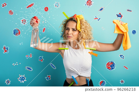 Funny housewife cleans and disinfects to keep germs, viruses and bacteria away. 96266218