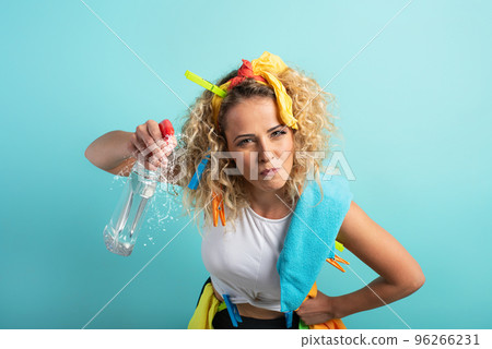 Funny housewife cleans and disinfects to keep germs, viruses and bacteria away. 96266231