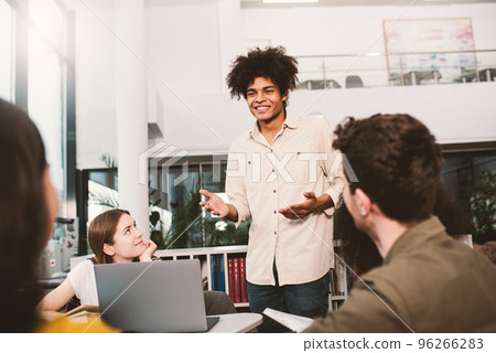 University students are studying in a library together. Concept of teamwork and preparation 96266283