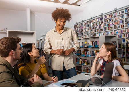 University students are studying in a library together. Concept of teamwork and preparation 96266852