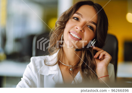 Young operator woman agent with headsets working in a call centre. Call center service. 96266896