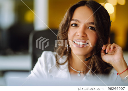 Young woman, student, teacher, business woman wear wireless headset video conference. Young woman, student, teacher, business woman wear wireless headset video conference. 96266907