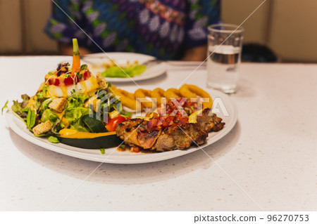 Grilled chicken with vegetables salad on a plate. Healthy Food Grilled chicken with vegetables salad on a plate. Healthy Food 96270753