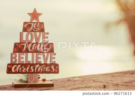 Christmas wooden toy tree on the beach 96271613