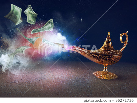 Banknotes exists from magic aladdin genie lamp in a desert 96271736