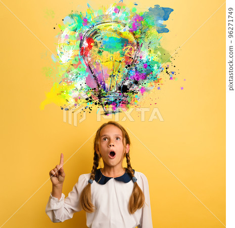 Emotional Child have a big idea. Surprised and amazed face expression. Yellow background 96271749