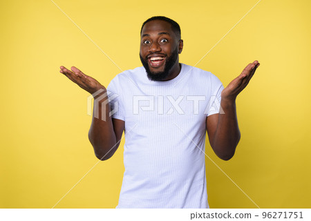 Afro man is happy about a great news. yellow background 96271751