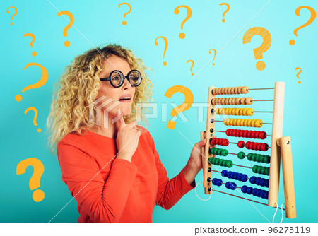 Girl with abacus is confused about the sum . cyan background 96273119