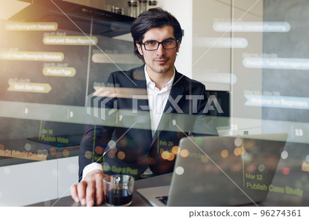 Man teleworker works at home with a laptop. Internet sharing effect 96274361