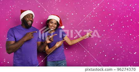 Amazed friends surprised by the arrival of Christmas. Purple background Amazed friends surprised by the arrival of Christmas. Purple background 96274370