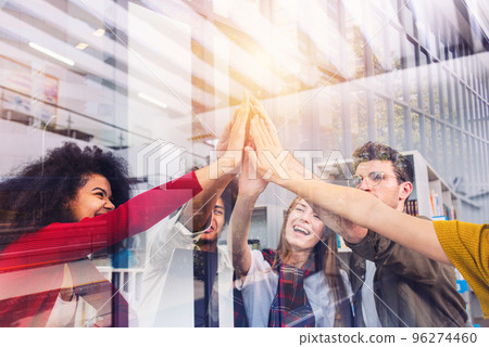 Business people putting their hands together. Concept of teamwork and partnership 96274460