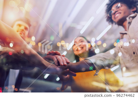 Business people putting their hands together. Concept of teamwork and partnership Business people putting their hands together. Concept of teamwork and partnership 96274462
