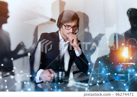 Businessman works from remote at house with a laptop due to coronavirus quarantine. Businessman works from remote at house with a laptop due to coronavirus quarantine. 96274471