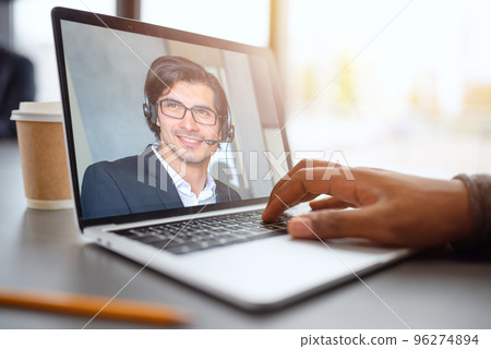 Businessman is working in remote with a videocall due to quarantine of coronavirus covid19. Concept of smart working. Company, office. 96274894