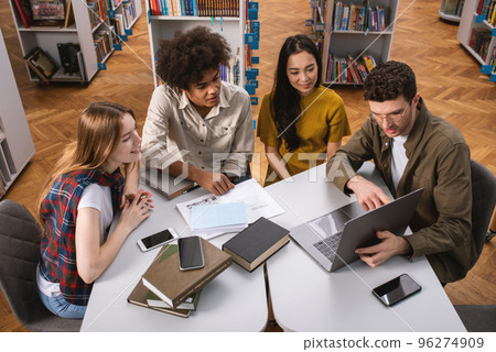 University students are studying in a library together. Concept of teamwork and preparation 96274909