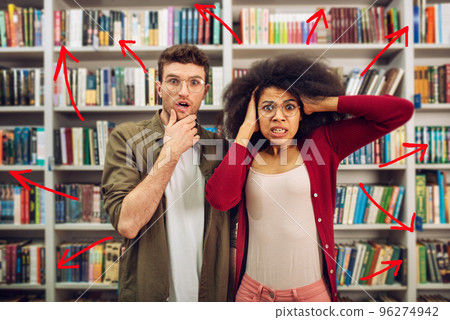 Young student with worried expression in a library 96274942