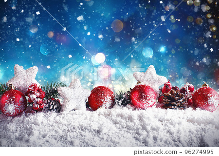 Christmas composition with balls, stars and garlands on snow 96274995