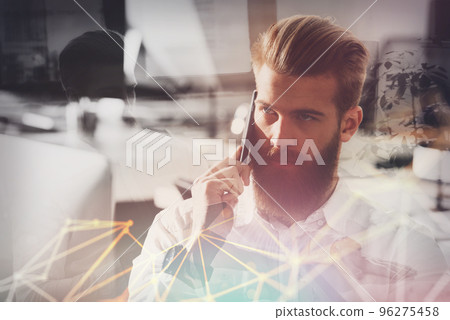 Businessman talking to the phone in office 96275458