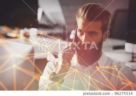 Businessman talking to the phone in office Businessman talking to the phone in office 96275514
