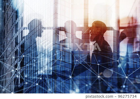 Handshaking business person in office with network effect. concept of teamwork and partnership. double exposure 96275734