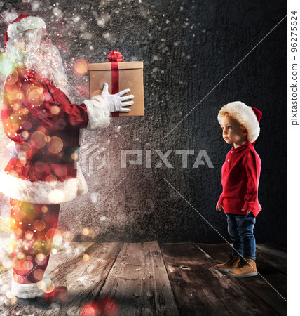 Santa Claus deliver a gift to a child Santa Claus deliver a gift to a child 96275824
