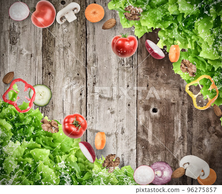 Background of mixed salad on wooden boards 96275857