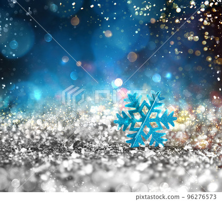 Silver sparkly crystal with snowflake background Silver sparkly crystal with snowflake background 96276573