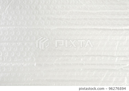 Texture of soft film for packaging close-up. The texture of the packaging air-bubble film on the whole screen. Texture of soft film for packaging close-up. The texture of the packaging air-bubble film on the whole screen. 96276894