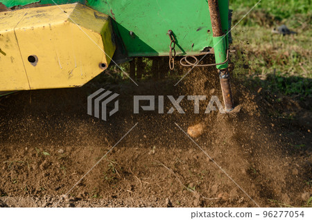 A mechanized method of harvesting potatoes in the village. 96277054