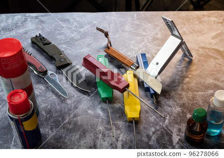 Various knives and sharpening stones. Care and repair of knives and tools. Workshop. Various knives and sharpening stones. Care and repair of knives and tools. Workshop. 96278066