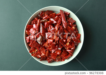 top view of large chili flakes on a bowl on table  96278308