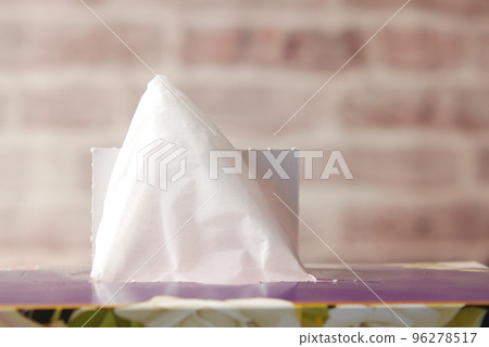 hand pull out a piece of tissue from tissue paper box hand pull out a piece of tissue from tissue paper box 96278517