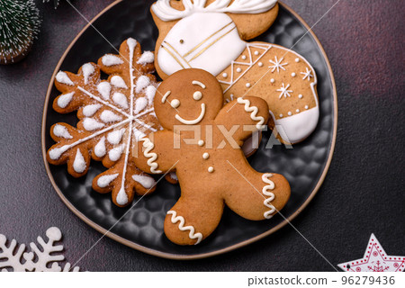 Home festive Christmas table decorated by toys and gingerbreads 96279436