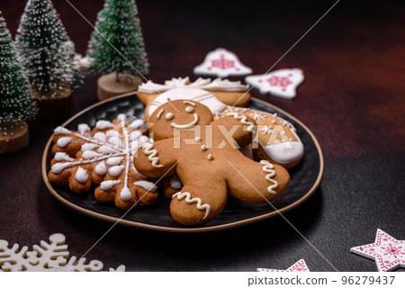 Home festive Christmas table decorated by toys and gingerbreads 96279437