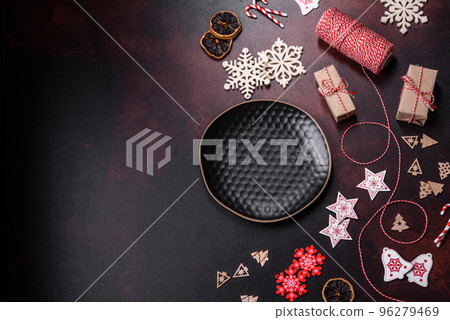 Home festive Christmas table decorated by toys and gingerbreads Home festive Christmas table decorated by toys and gingerbreads 96279469