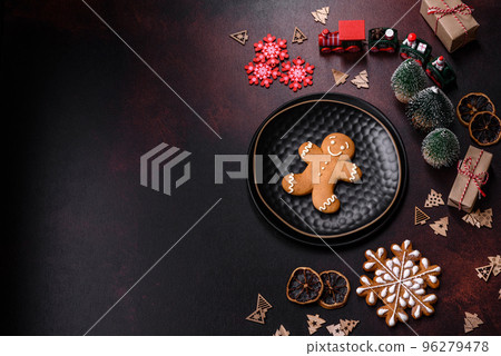 Home festive Christmas table decorated by toys and gingerbreads 96279478