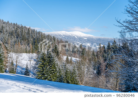 Picturesque wintertime landscape on sunny snowy day. Hilly countryside of Giant Mountains, Czech: Krkonose, Czech Republic 96280046