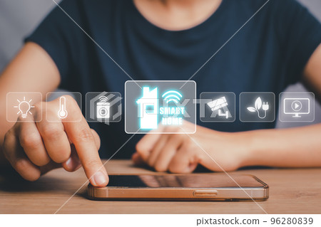 Smart home automation control system, Woman hand using smart phone with smart home control icon on VR screen, Innovation technology internet network concept. Smart home automation control system, Woman hand using smart phone with smart home control icon on VR screen, Innovation technology internet network concept. 96280839
